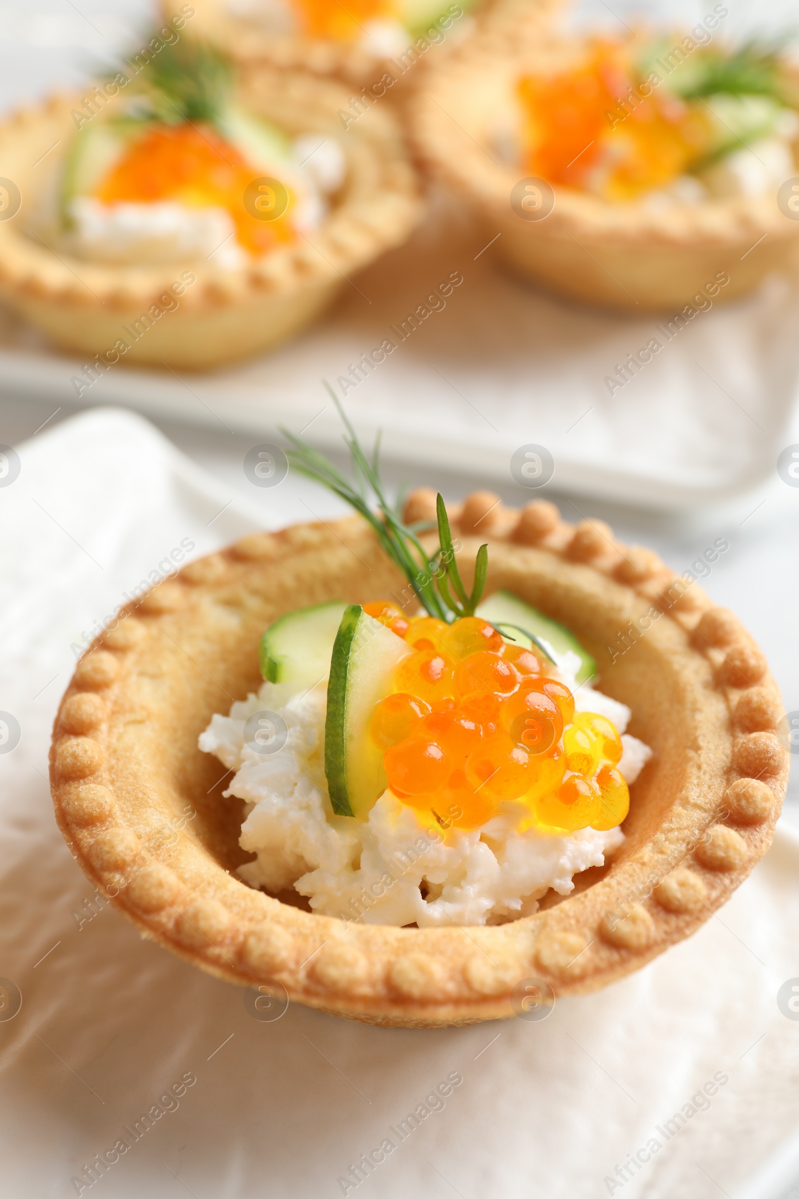 Photo of Delicious canapes with red caviar on table, closeup