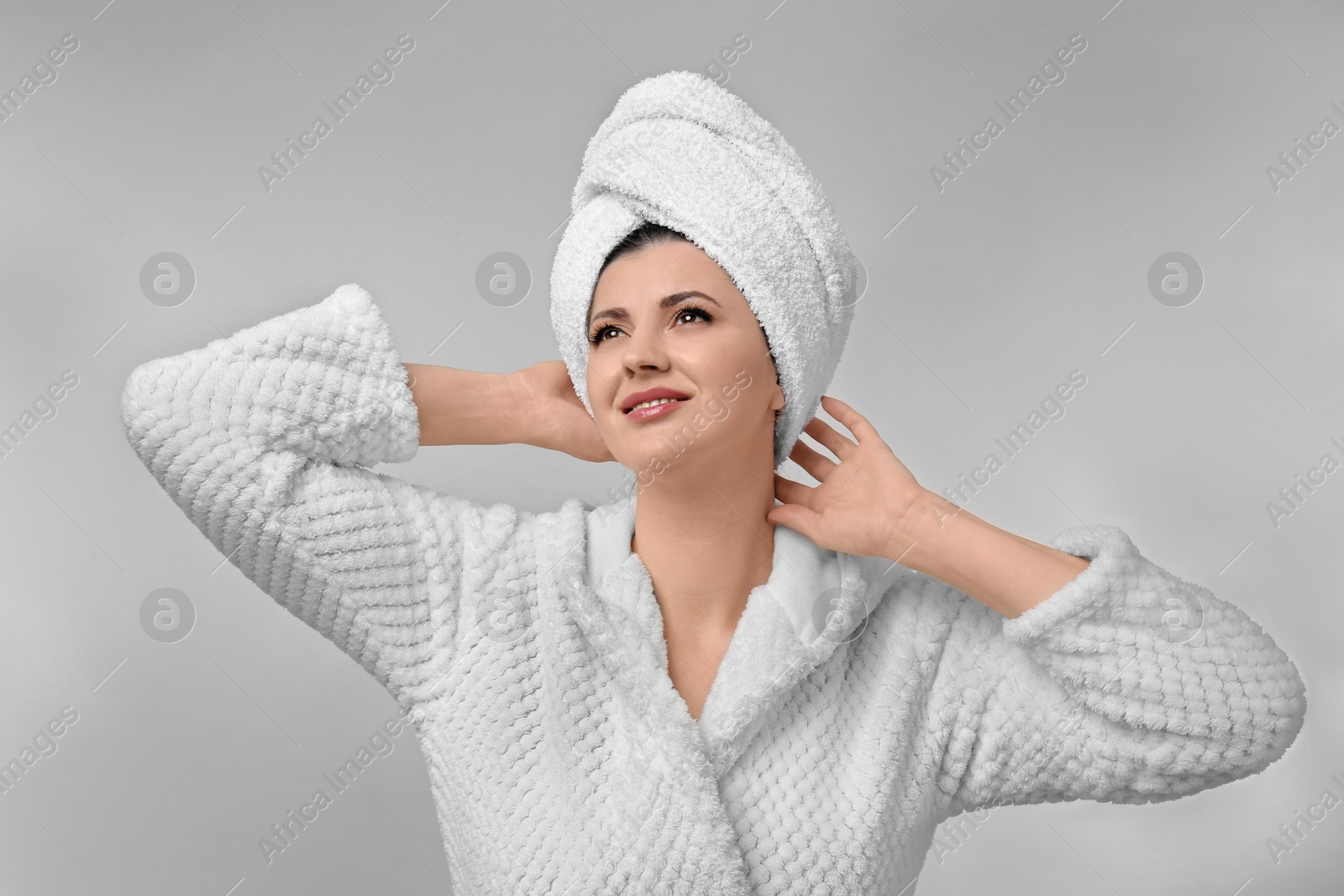 Photo of Beautiful woman with clean perfect skin on light background