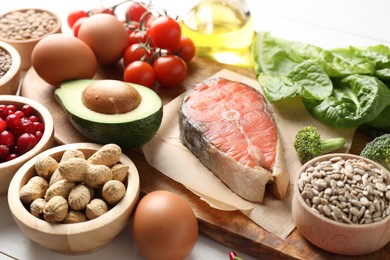 Many different healthy food on white table, closeup