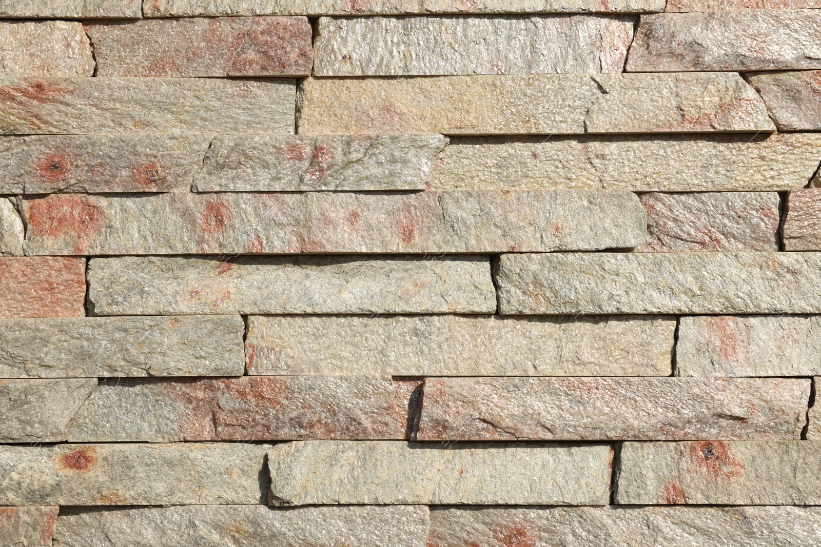 Photo of Texture of beige brick wall as background