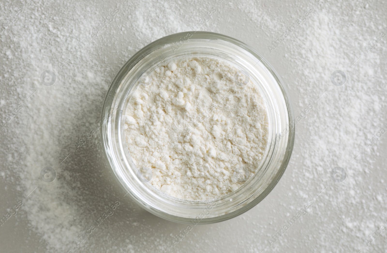 Photo of Rice loose face powder on light grey background, top view. Makeup product