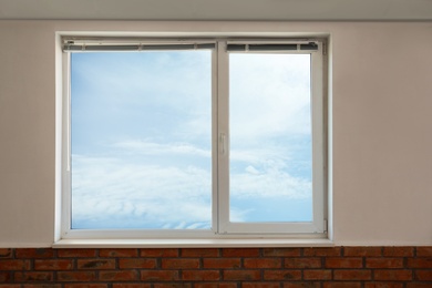 Photo of New modern glazed window indoors. Home interior