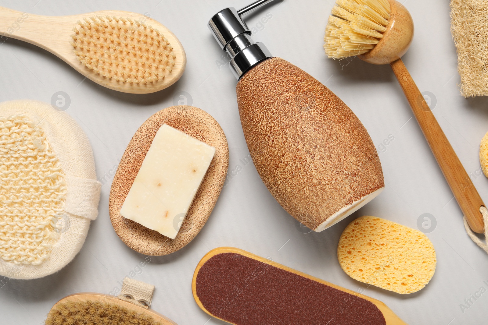 Photo of Bath accessories. Flat lay composition with personal care tools on light grey background