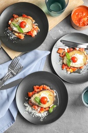 Flat lay composition with baked eggplant, tomatoes and cheese served on table