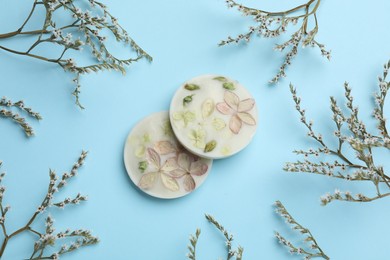 Flat lay composition with scented sachets on light blue background