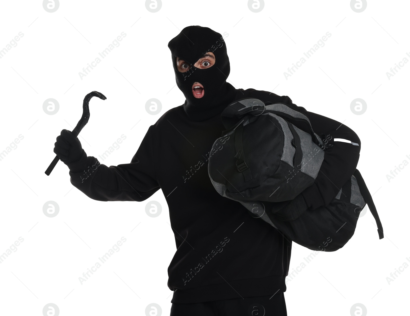 Photo of Emotional thief in balaclava with crowbar and bag on white background