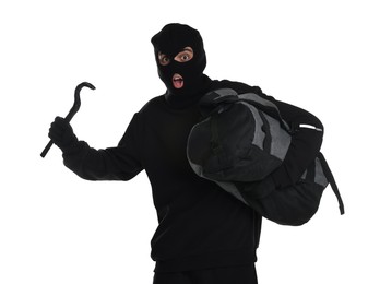 Emotional thief in balaclava with crowbar and bag on white background