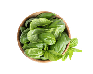 Fresh green basil leaves in wooden bowl isolated on white, top view