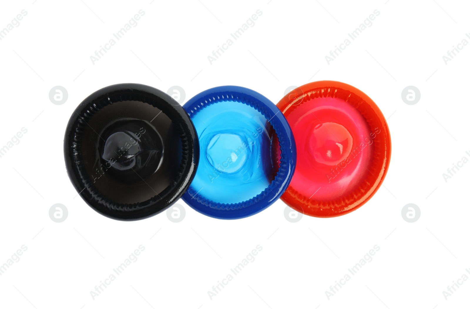 Photo of Unpacked colorful condoms on white background, top view. Safe sex