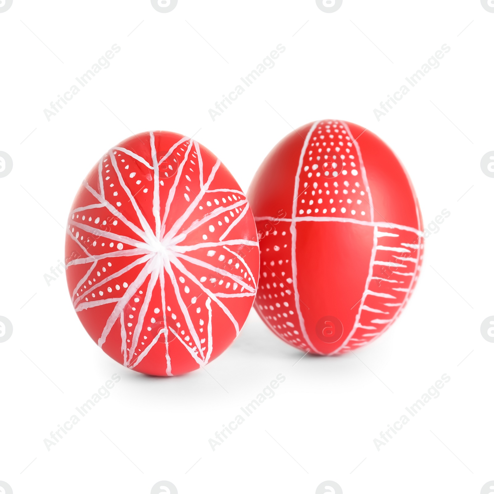 Photo of Creative painted red Easter eggs on white background