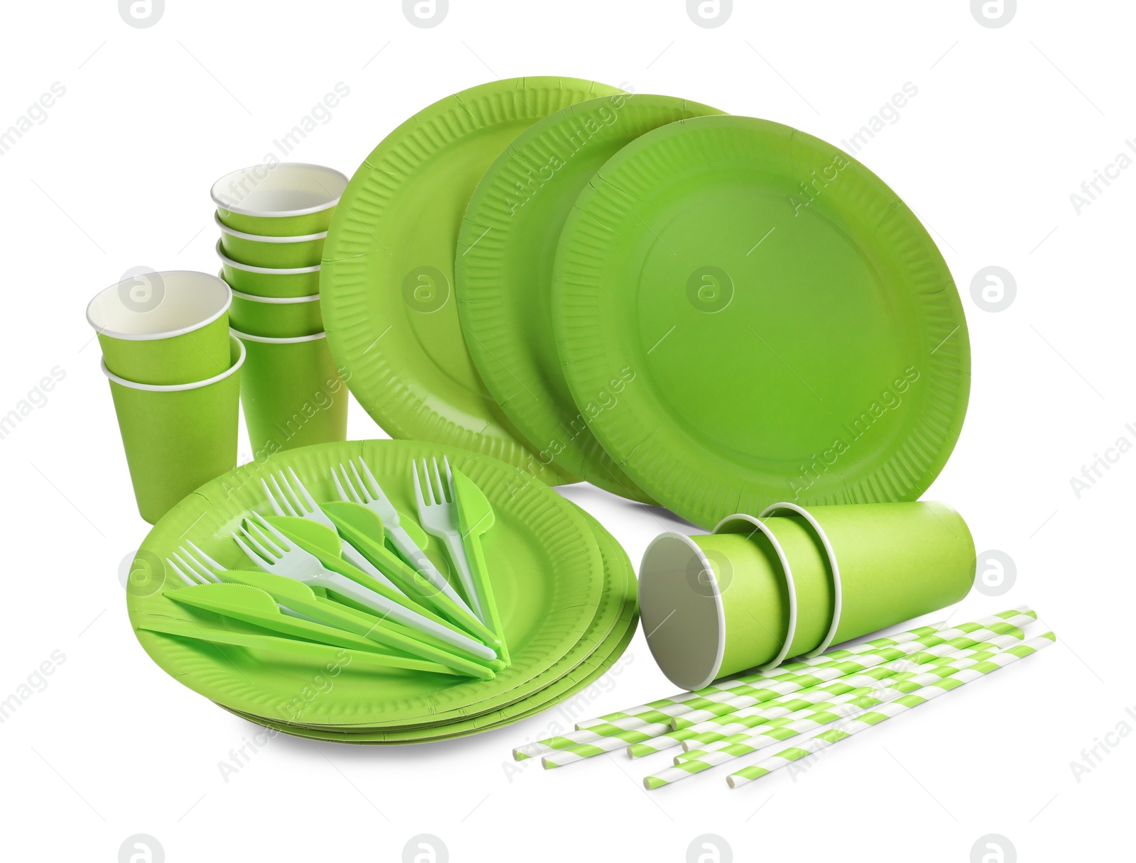 Photo of Set of bright disposable tableware on white background