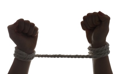 Photo of Freedom concept. Woman with tied arms on white background, closeup