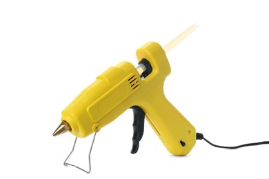 Photo of Yellow glue gun with stick isolated on white
