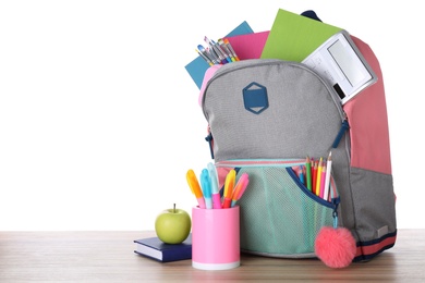 Modern backpack with stationery on white background