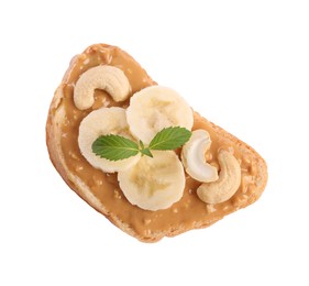 Photo of Toast with nut butter, banana slices and cashews isolated on white, top view