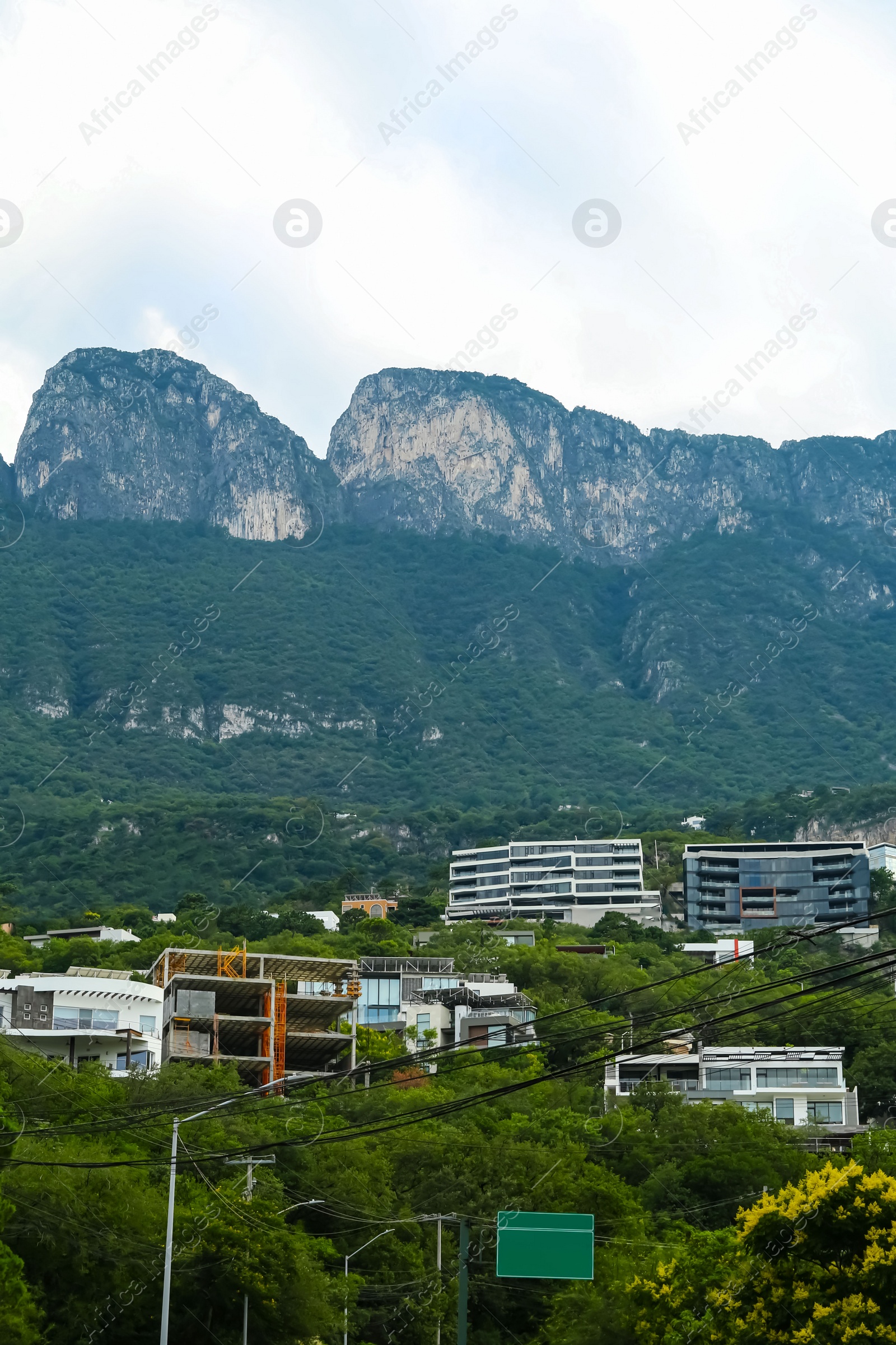 Photo of Beautiful view of city and green mountains