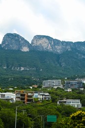 Photo of Beautiful view of city and green mountains