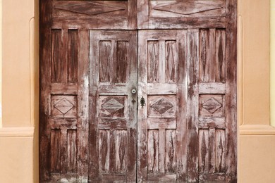 Photo of Exterior of building with old wooden gates