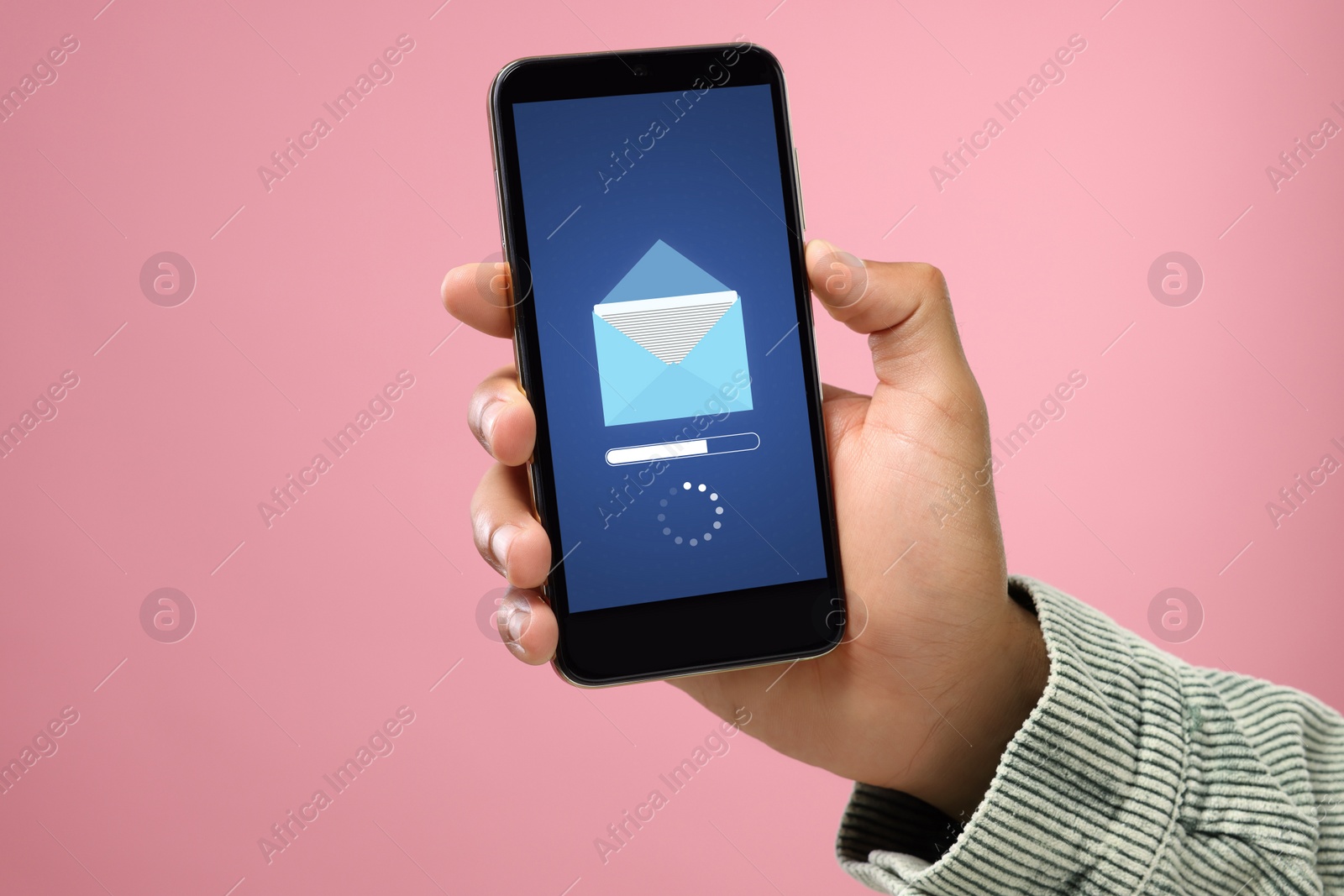 Image of Got new message. Man using smartphone on pink background, closeup