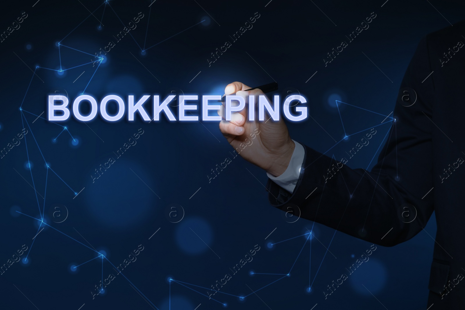Image of Bookkeeping concept. Businessman with pen writing word on dark blue background, closeup