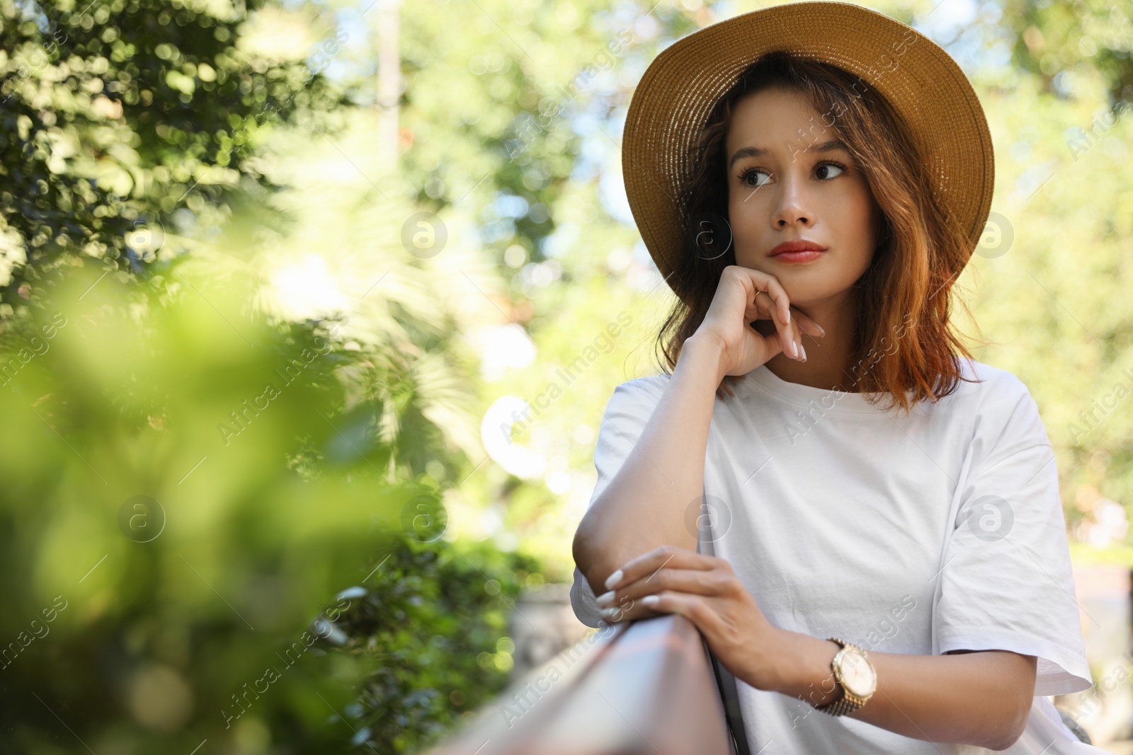 Photo of Portrait of beautiful young woman outdoors on sunny day. Space for text