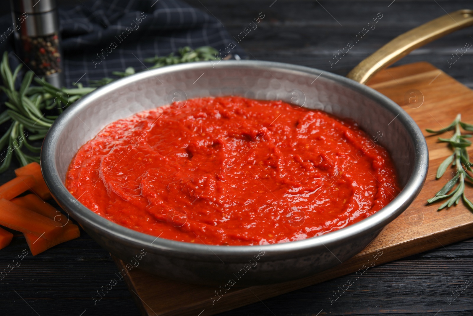 Photo of Delicious tomato sauce in pan, closeup view