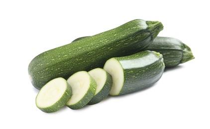 Photo of Whole and cut green ripe zucchinis isolated on white