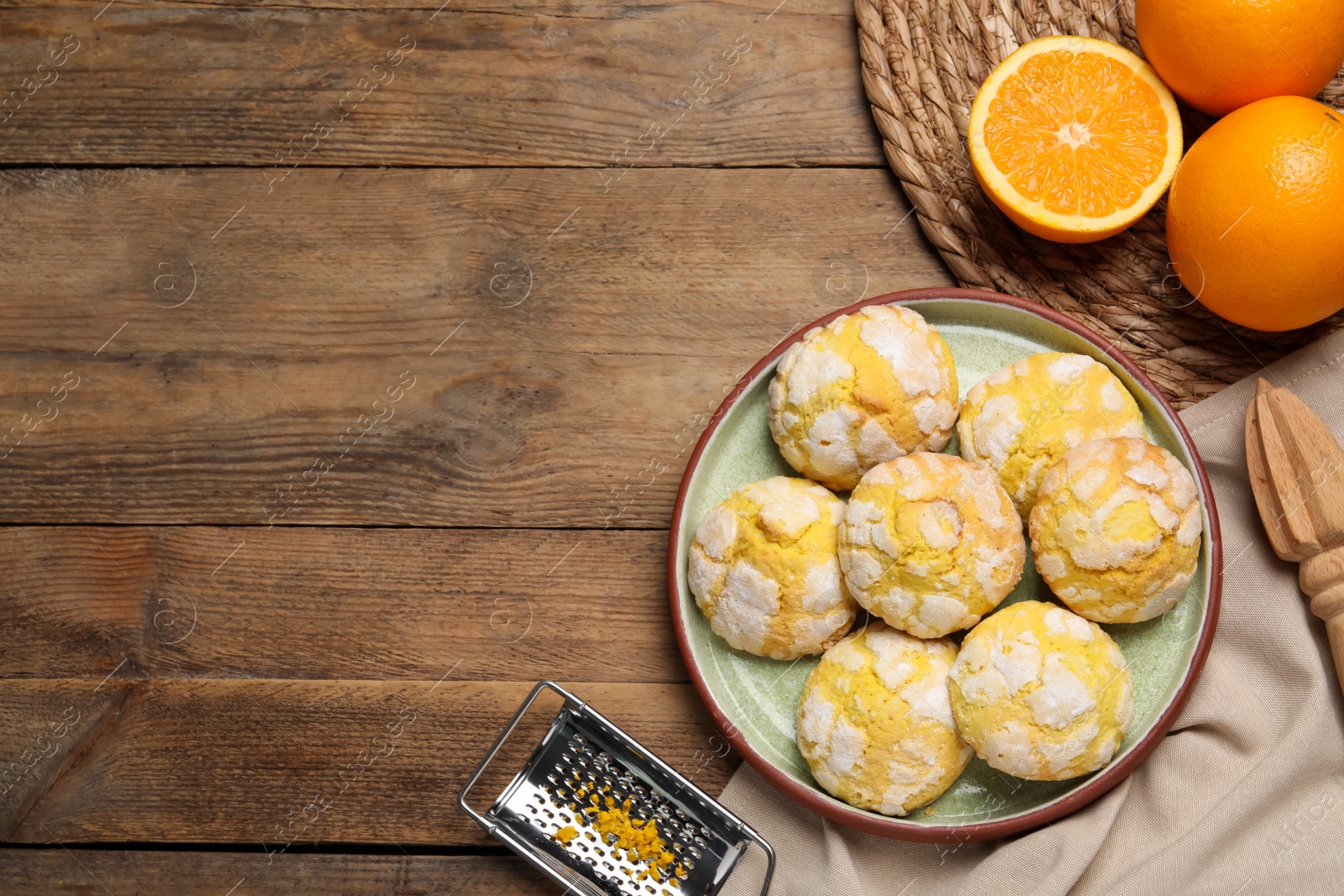 Photo of Plate with tasty homemade cookies on wooden table, flat lay. Space for text