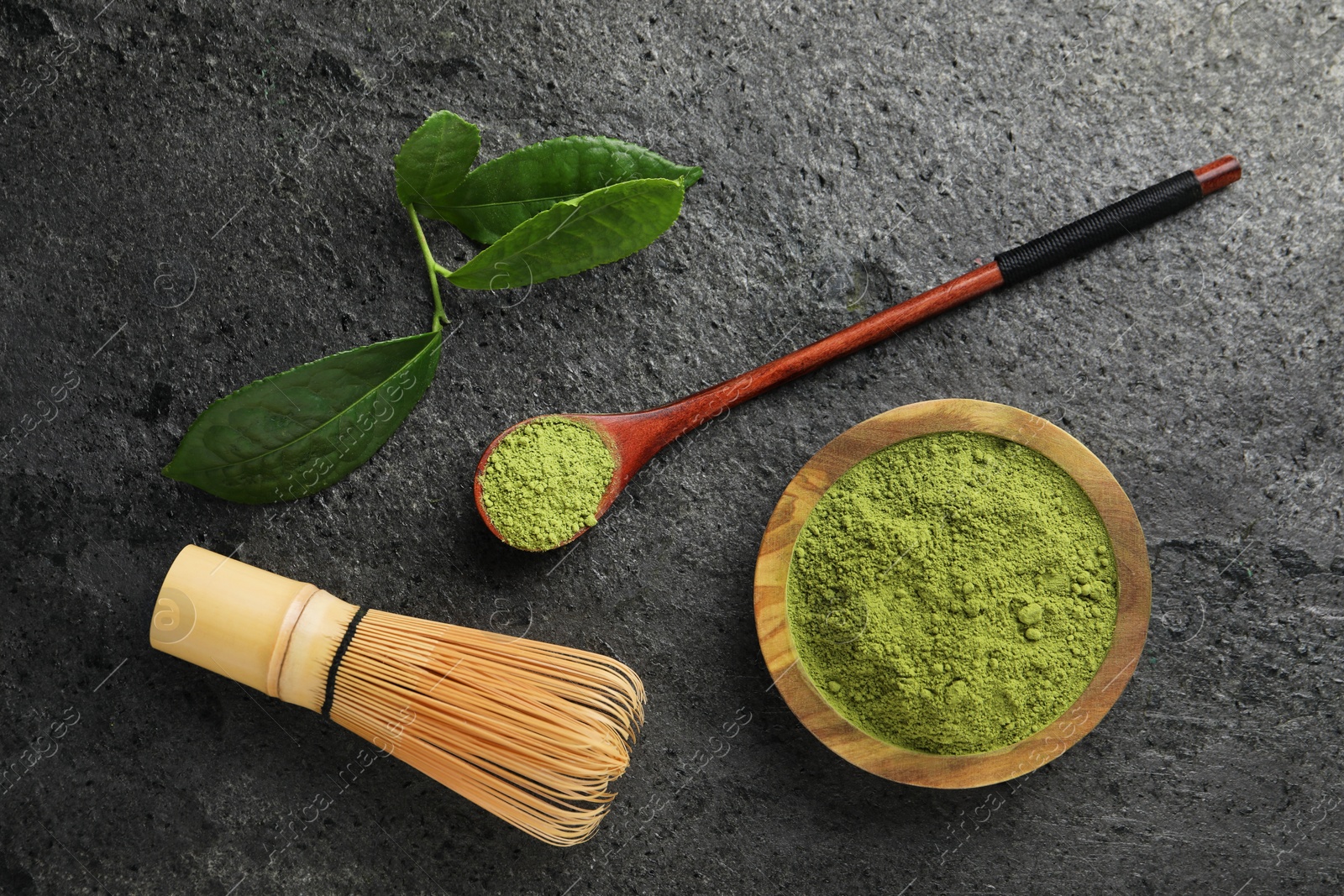 Photo of Flat lay composition with green matcha powder on grey table