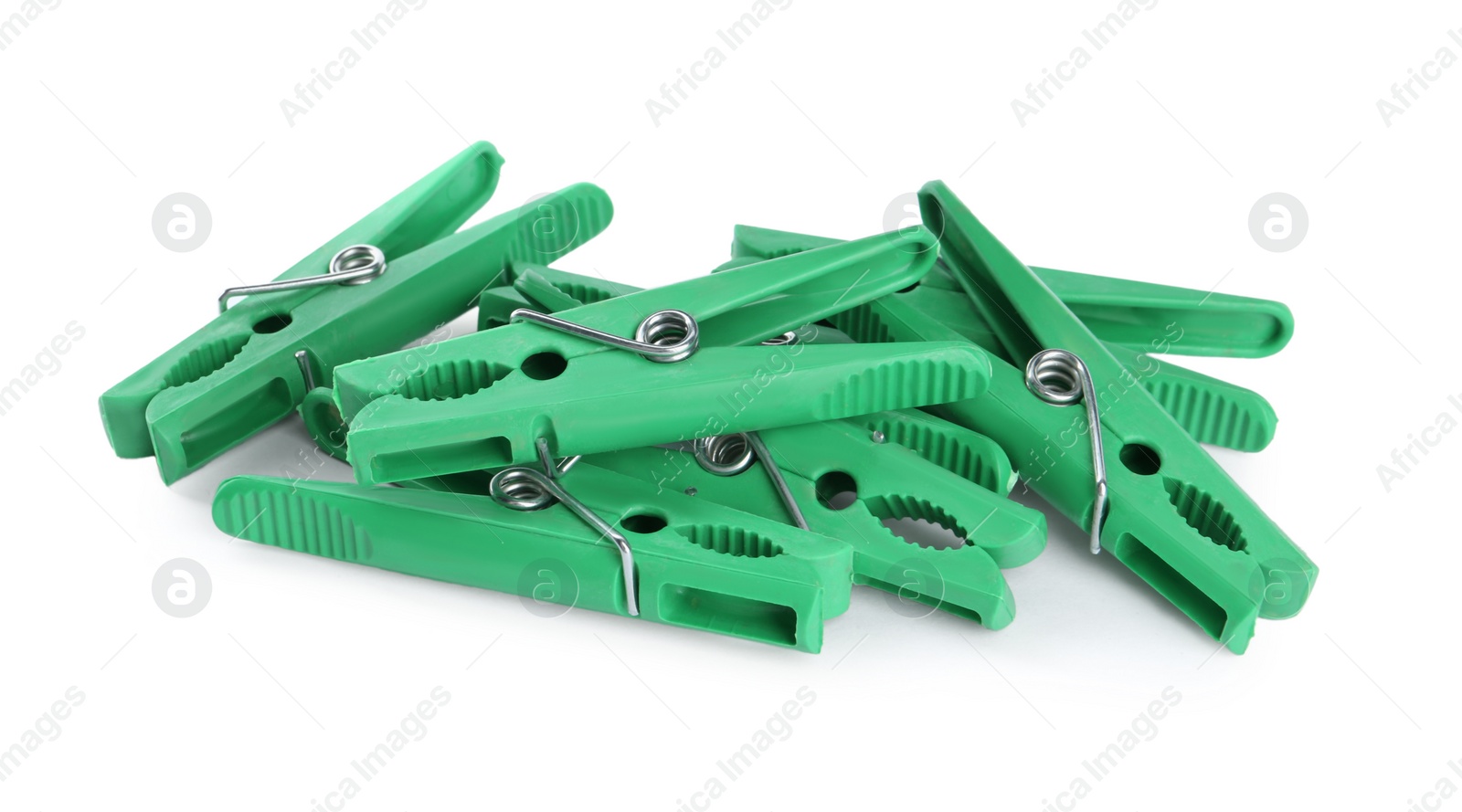 Photo of Bright green plastic clothespins on white background