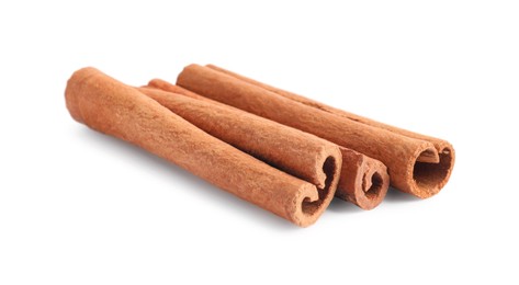 Photo of Three aromatic cinnamon sticks isolated on white