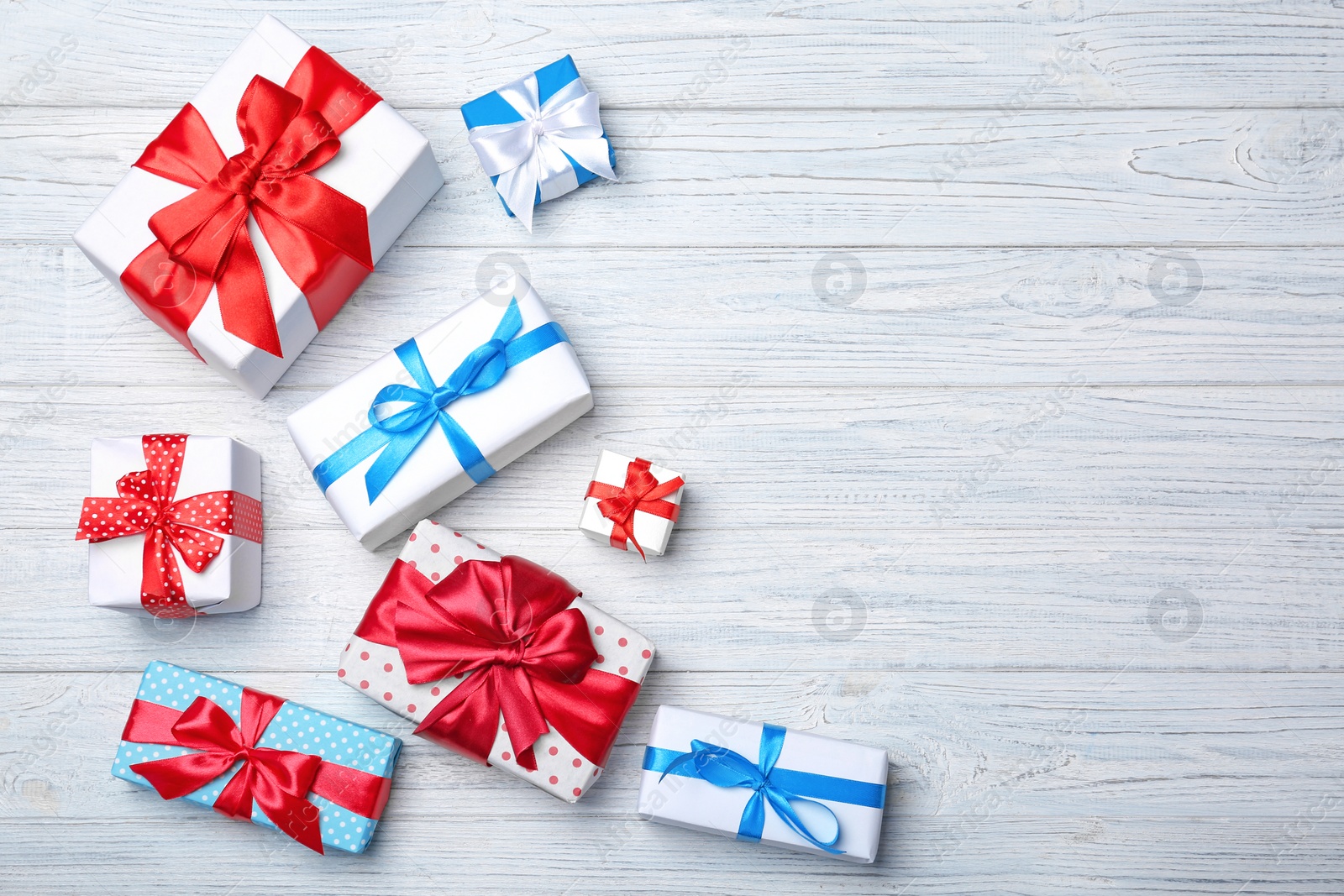 Photo of Flat lay composition with different gift boxes on wooden background