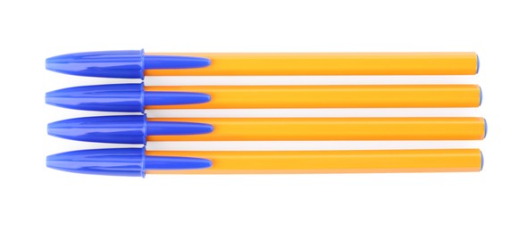 New orange plastic pens isolated on white, top view
