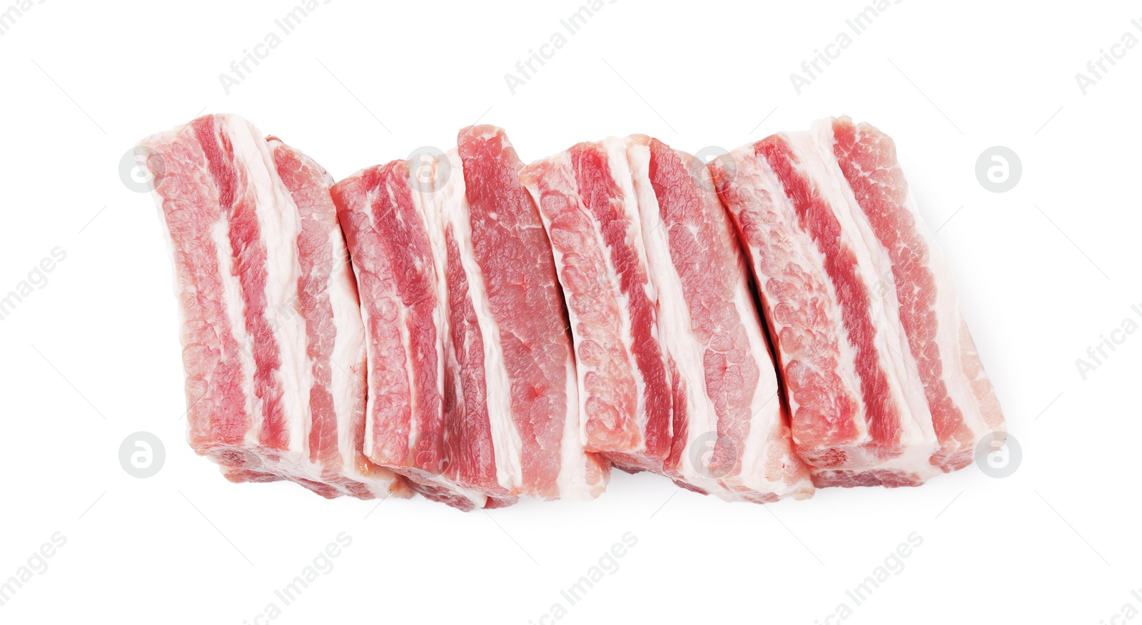 Photo of Cut raw pork ribs isolated on white, top view