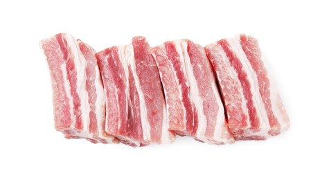 Photo of Cut raw pork ribs isolated on white, top view