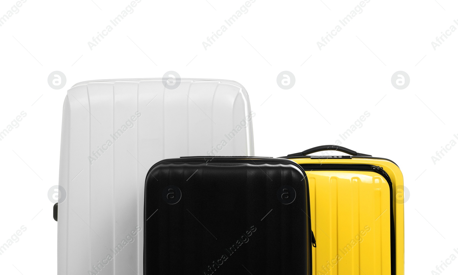 Photo of New suitcases packed for journey on white background