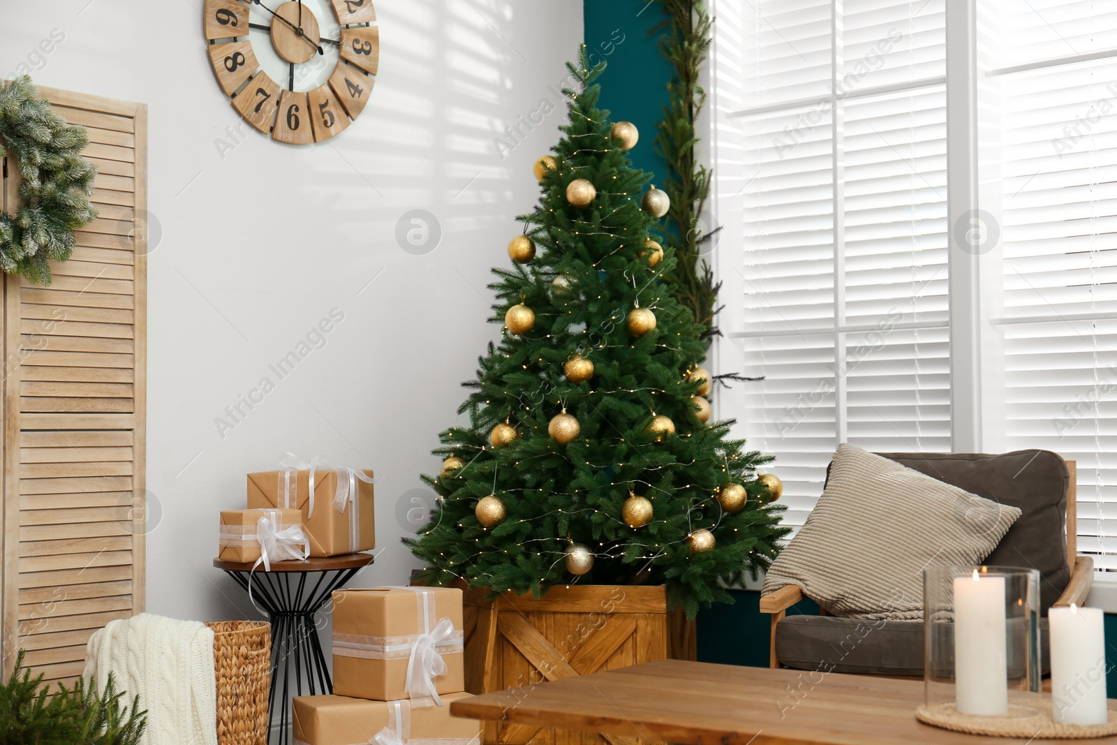 Photo of Beautiful decorated Christmas tree in living room interior