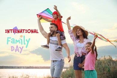 Image of Happy parents and their children playing with kites outdoors. Happy Family Day