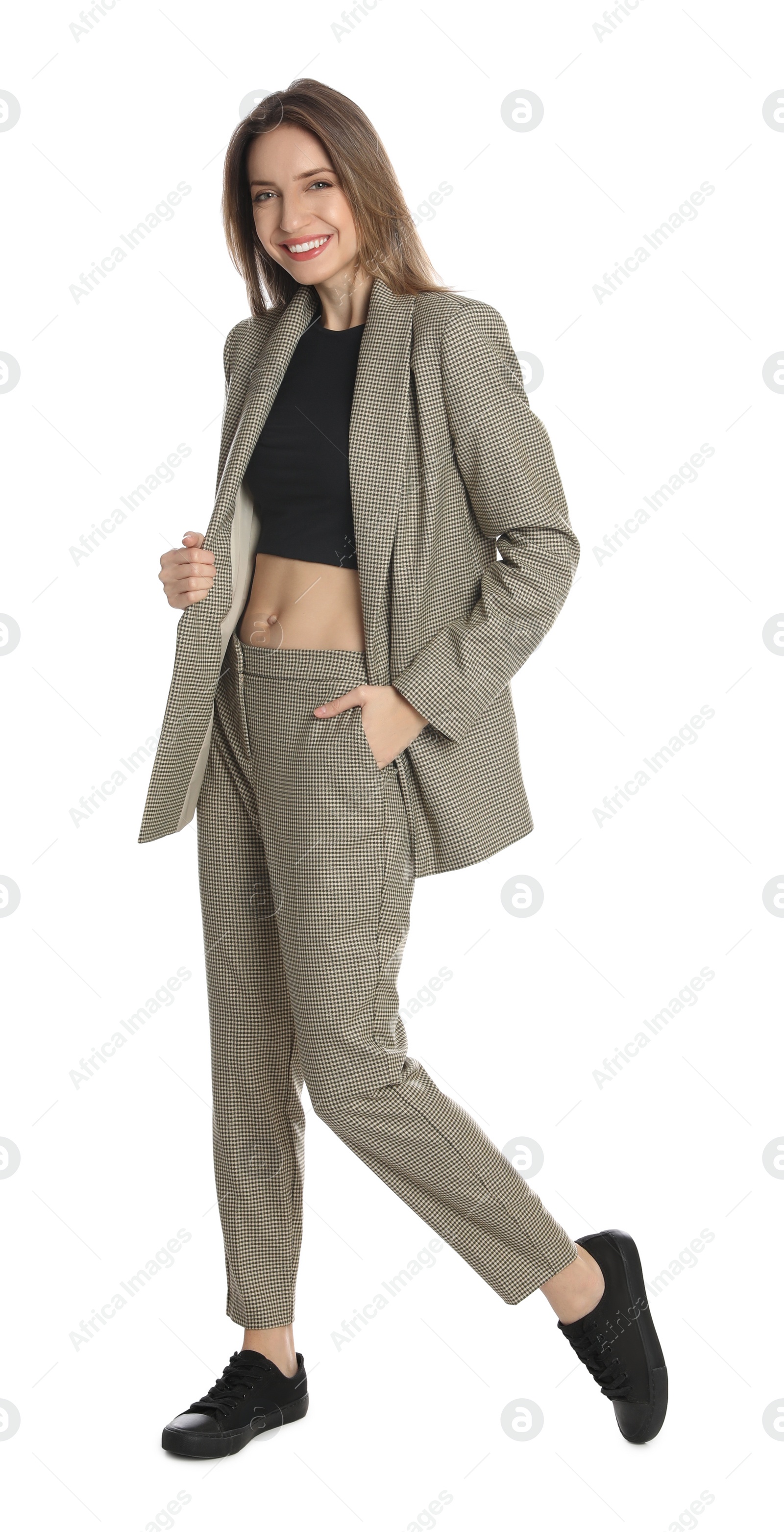 Photo of Full length portrait of beautiful young woman in fashionable suit on white background. Business attire