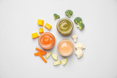 Photo of Healthy baby food and ingredients on white background, top view