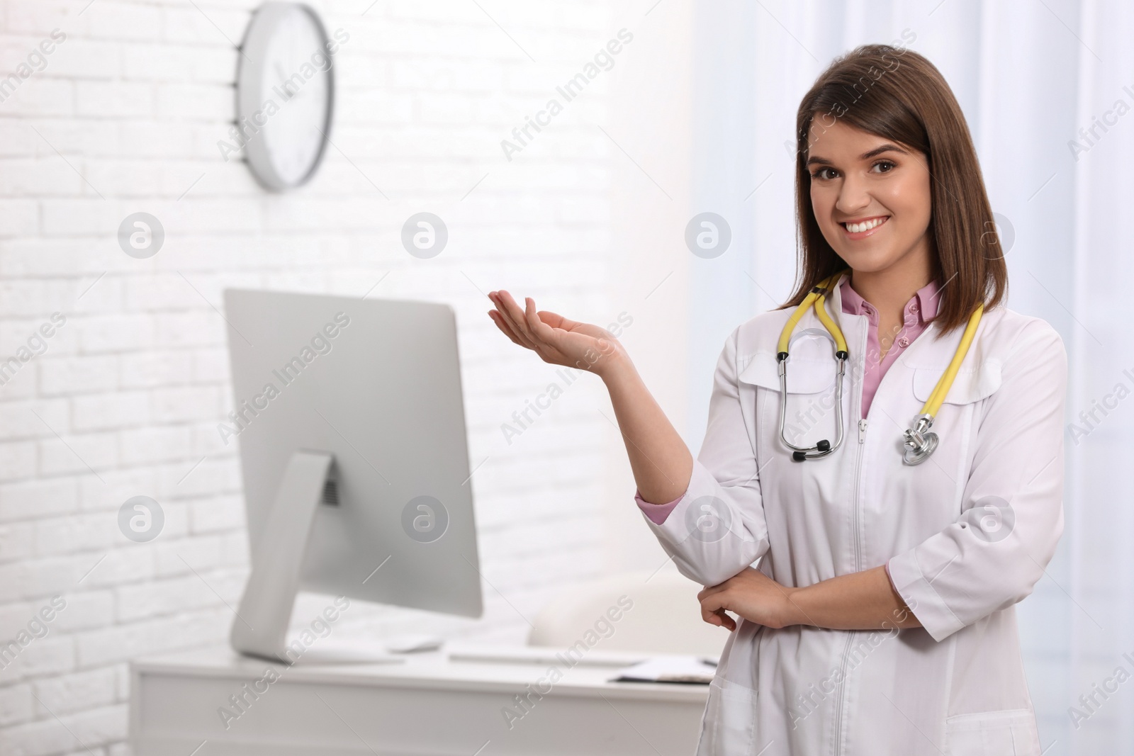 Photo of Portrait of pediatrician with stethoscope in clinic