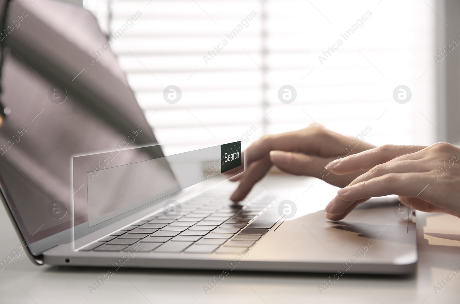 Image of Search bar of website over laptop. Woman using computer at table, closeup