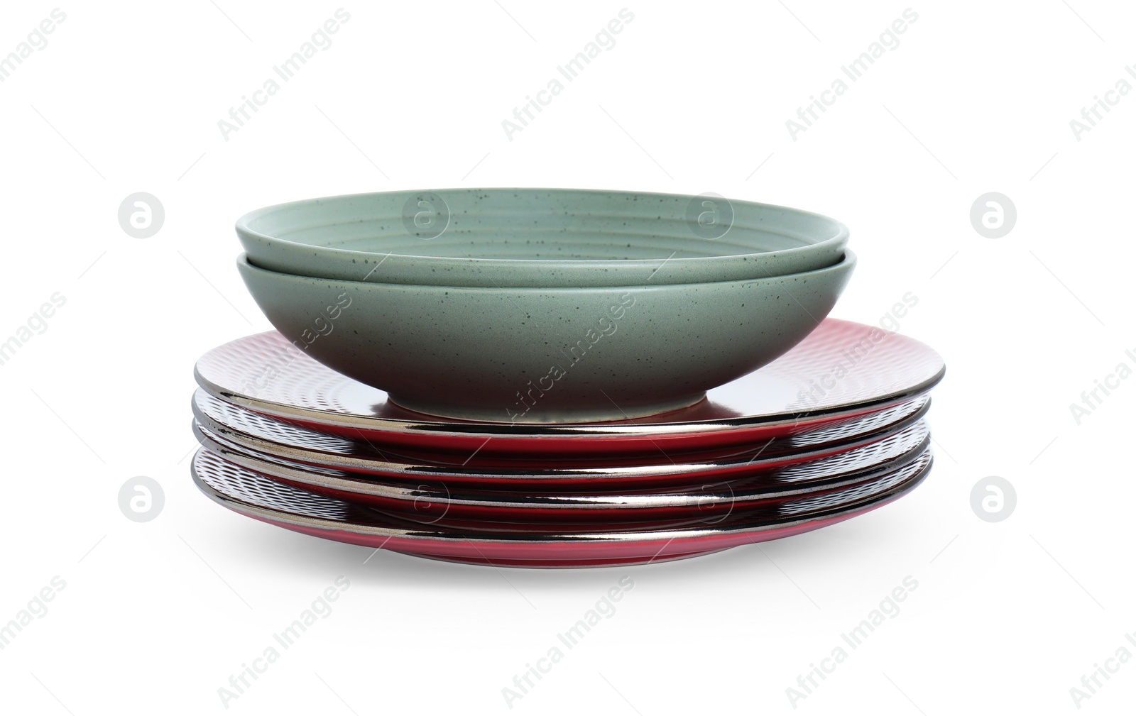 Photo of Stack of beautiful ceramic plates and bowls isolated on white