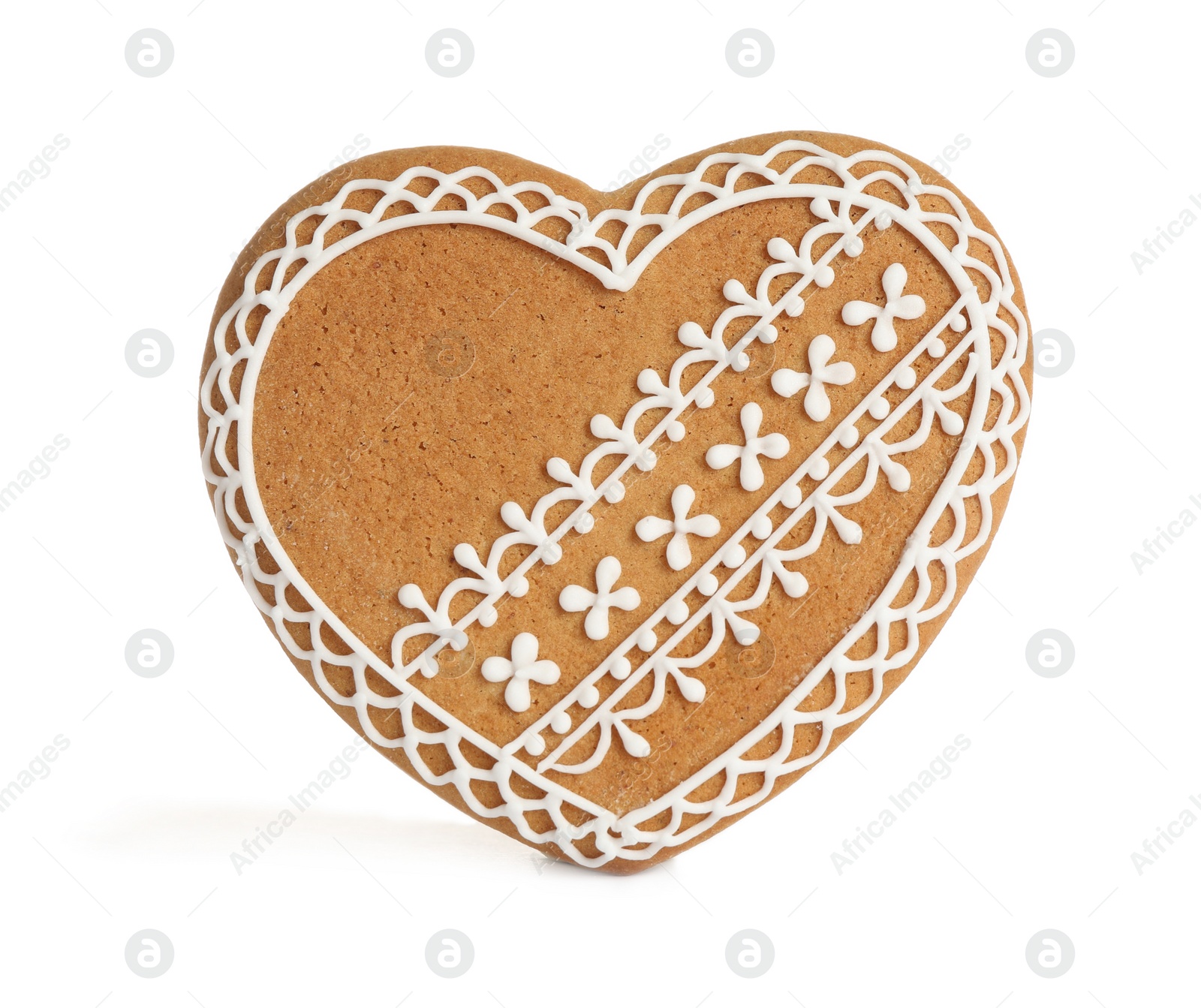 Photo of Gingerbread heart decorated with icing isolated on white