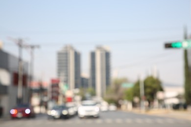 Photo of San Pedro Garza Garcia, Mexico – March 20, 2023: Blurred view of road with cars and buildings, bokeh effect