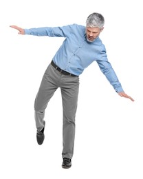 Photo of Mature businessman in stylish clothes posing on white background