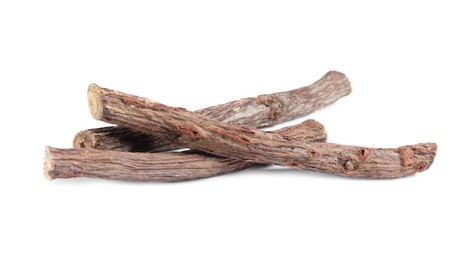 Photo of Dried sticks of liquorice root on white background