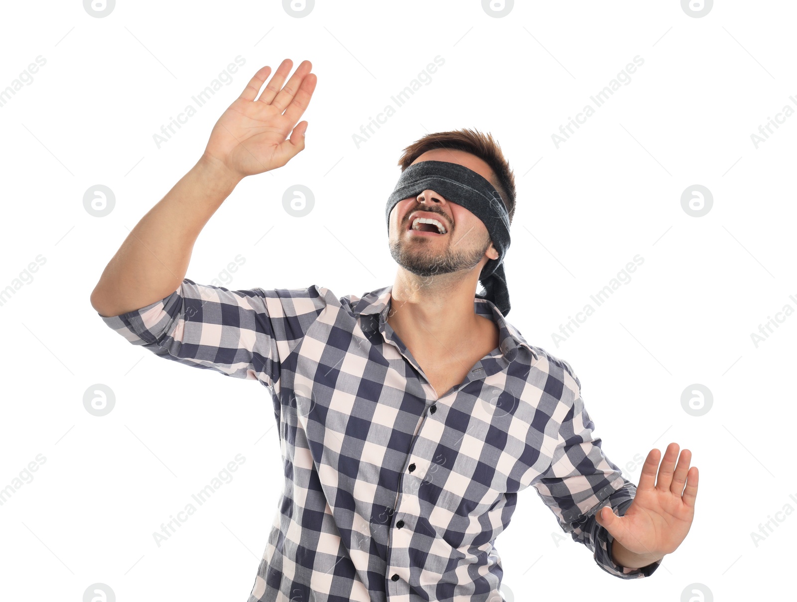 Photo of Young man with black blindfold on white background