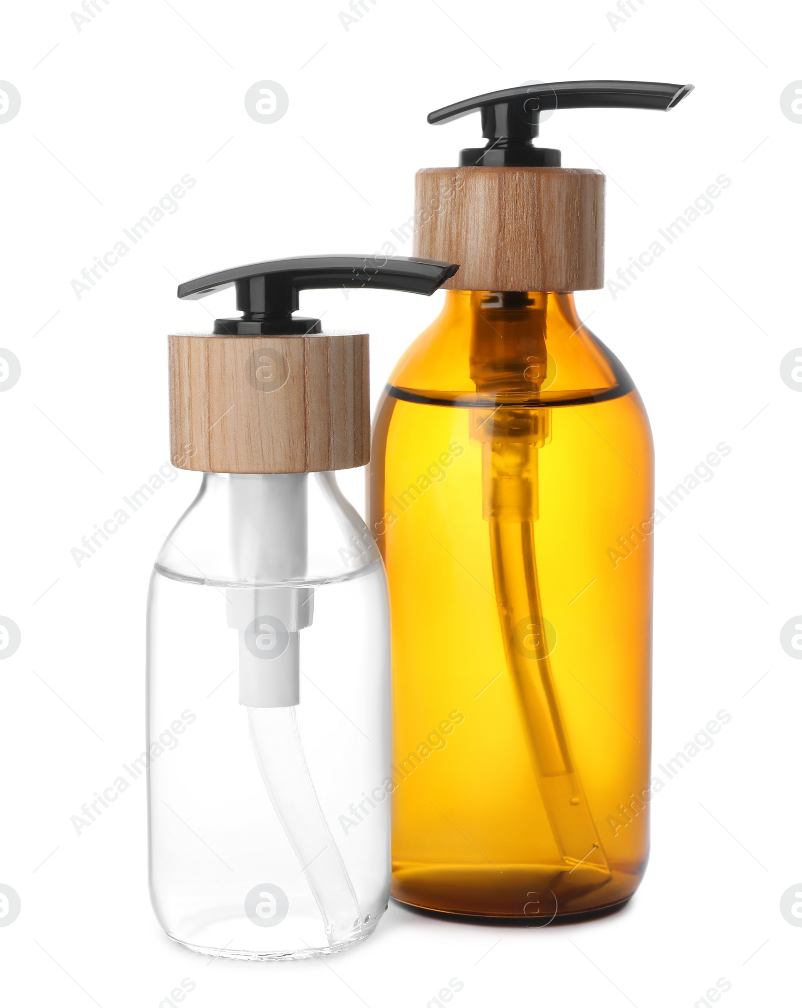 Photo of Bottles with dispenser caps on white background