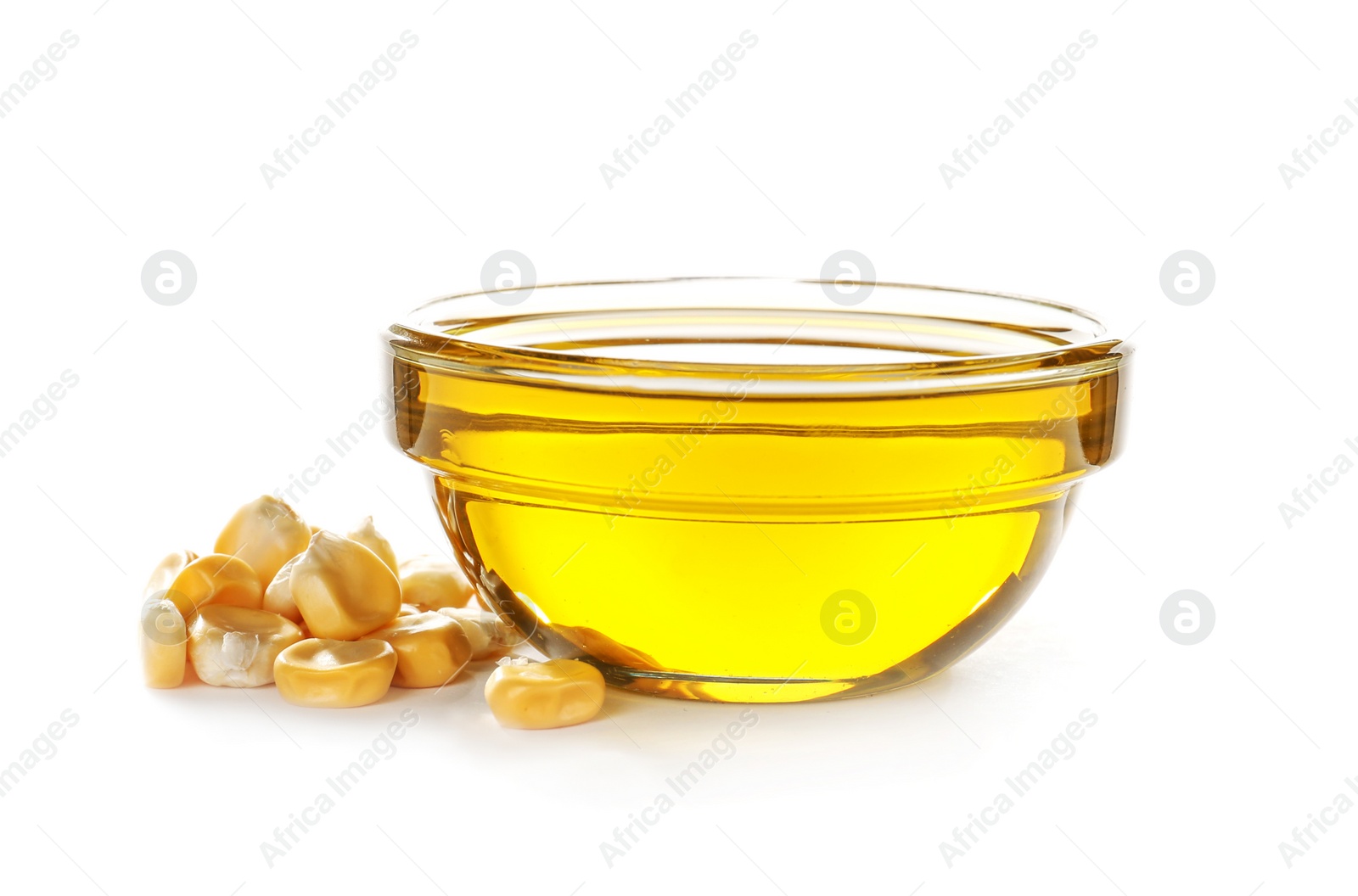 Photo of Bowl with fresh corn oil and kernels on white background